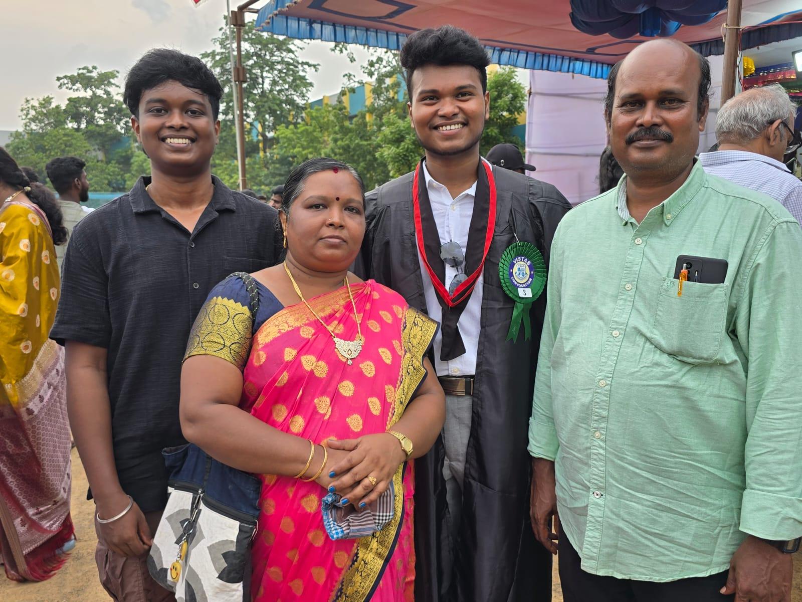 Premkumar Manivel in convocation robes with his family